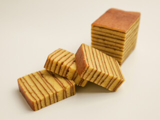 Layer cake, sliced, isolated on white background
