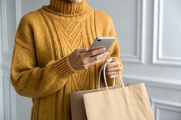 Person Mobile Shopping with Paper Bag, Online Retail