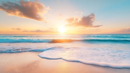Gentle waves kiss the shore beneath a glowing sky as dawn breaks peacefully over the ocean’s edge.

