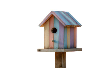 Pastel-colored birdhouse on a post