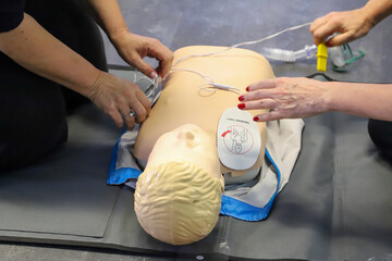 first aid course - company safety - cardiac massage - Basic Life Support. cardiac massage on...