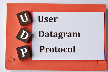 Fototapeta premium USER DATAGRAM PROTOCOL - words on a white sheet with a red background