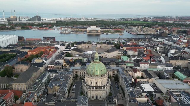 Aerial view of Frederik's Church and Amalienborg Palace amidst the urban landscape, creating a mesmerizing blend of architectural styles, Copenhagen, Denmark.