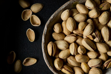  Close up top view pistachios in a old bowl
