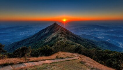 Sunrise over mountain peak, hiking trail