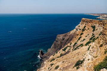 Cape Fiolent in Crimea, view of Black Sea and cliff in summer on sunny day