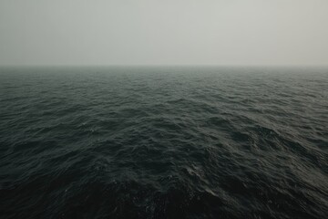 Vast, dark sea, shrouded in fog