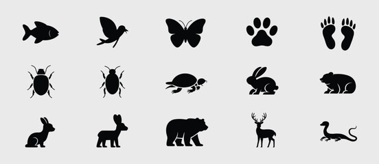 Fototapeta premium Collection of black animal silhouettes on a light gray background