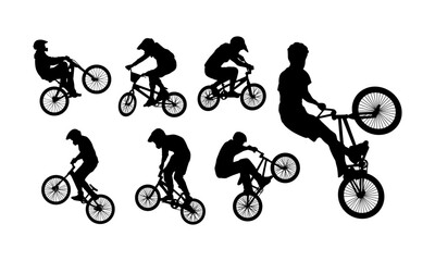 Naklejka premium silhouettes of bmx riders performing stunts