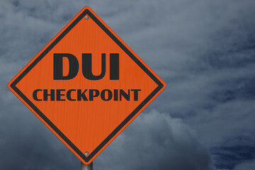 DUI checkpoint warning sign with stormy sky