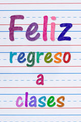 Back to School  Feliz Regreso a clases with crayons with ruled loose leaf paper
