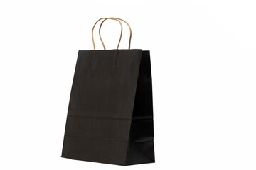 A black paper bag with brown twisted paper handles, set against a plain white background.