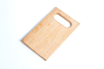wooden cutting board with a handle cut out of one end, isolated on a white background.