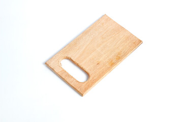 wooden cutting board with a handle cut out of one end, isolated on a white background.