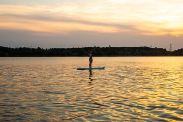 Beautiful woman on Stand Up Paddle Board. SUP.
