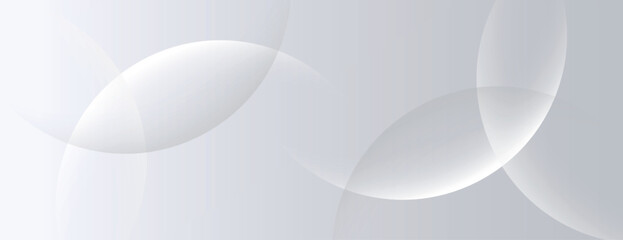 A soft gray background with overlapping translucent circles. The gray background has a smooth, minimalist texture, enhancing the gray tones. Minimal abstract circles vector gradient background