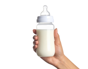 Hand Holding Baby Bottle Filled With White Milk isolated on transparent background. PNG die-cut for advertising