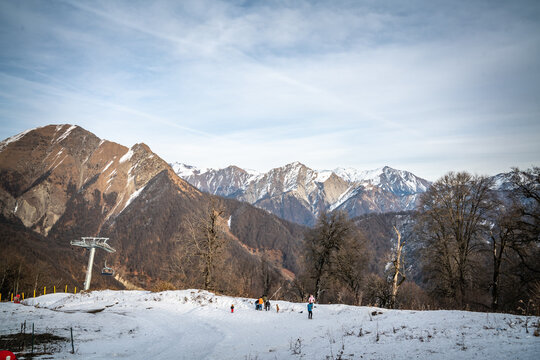 View of the snow-capped mountain range with a lot of snow in the foreground as well.