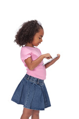 schoolgirl, ethnic, in school clothes, standing writing on a tablet held in her hands, copy space isolated on white background