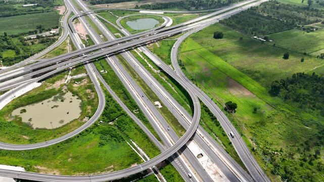 Aerial view drone footage of a complex bridge intersection where multiple highway numbers 290 and 304 Nakhon Ratchasima Thailand
