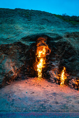 Horizontal close up of fire burning naturally at the Yanar Dag fire mountain at Azerbaijan