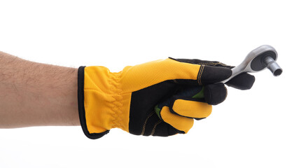 Hand holding a wrench in protective gloves