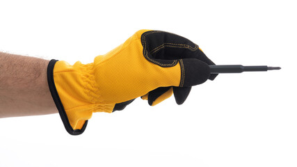 Hand with yellow glove holding a tool for repair