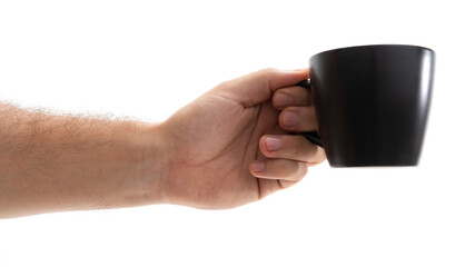 Hand with black mug on white