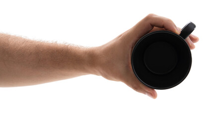 Hand holding a black mug against white background