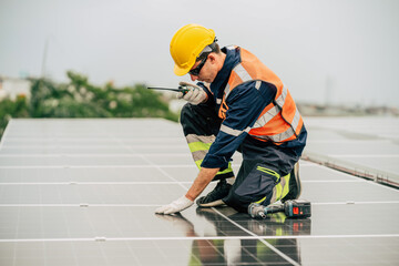 Technician performs maintenance on solar panels during overcast weather at a rooftop installation...
