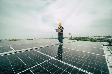 Technician monitors solar panel performance on rooftop in urban setting during overcast daytime