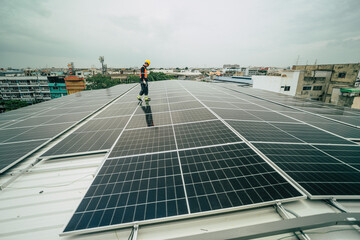 Technician installs solar panels on rooftop in urban setting during overcast weather
