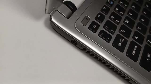Detail of Grey Computer Keyboard with White Background for Technology Concept