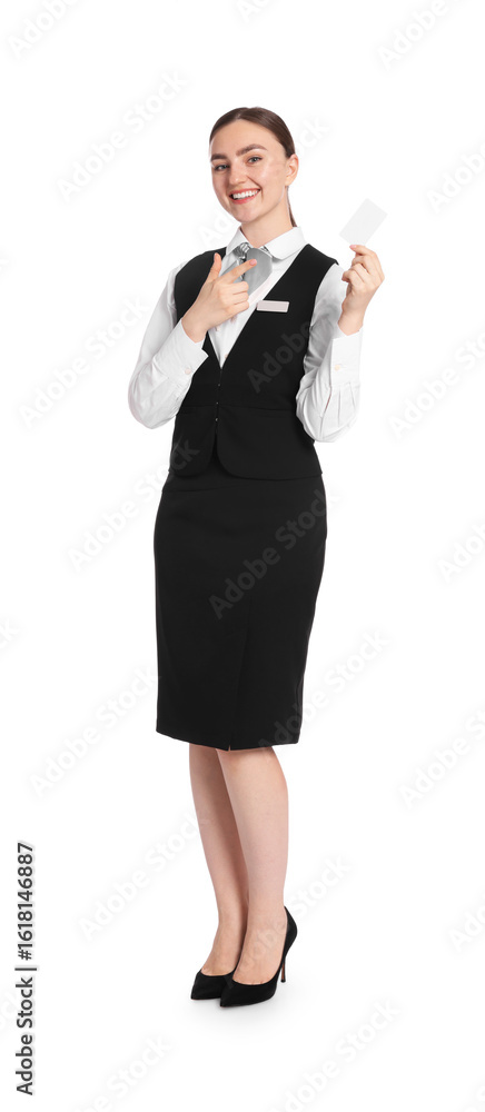 Poster smiling receptionist in uniform pointing at hotel key card on white background