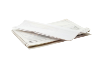 Important documents are organized neatly on a table in a bright office space during the day for efficient processing and review