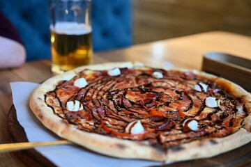 The scene is set in a cozy restaurant or pub, showcasing a casual dining atmosphere. Ideal for...