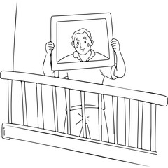 Man holding a photo frame while standing at a balcony railing - Concept of World Mental Health Day    