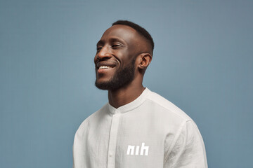 joyful portrait of person with bright laugh set against clean solid background