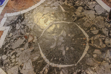 Ornate Stone Mosaic Flooring in a Historic Building.
Intricate Marble Floor Design of a Cathedral