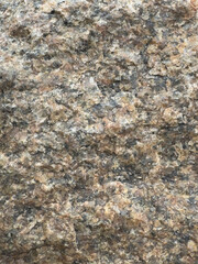 Background, Granite Rock Texture with Natural Brown and Gray Patterns in Close-Up View. Backdrop