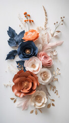 Colorful paper flowers bloom in soft layers, shaped by delicate cuts and careful hands