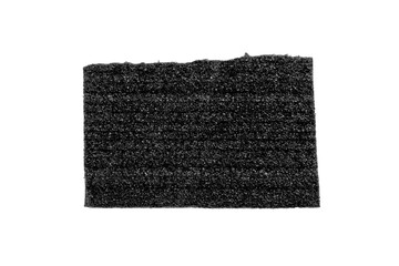 Piece of black porous foam padding with layered structure and soft textured surface isolated on white background. Protective packaging material