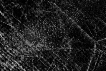 Black grunge old rotting material with aged worn wrinkles and rough scratches. Dark abstract background