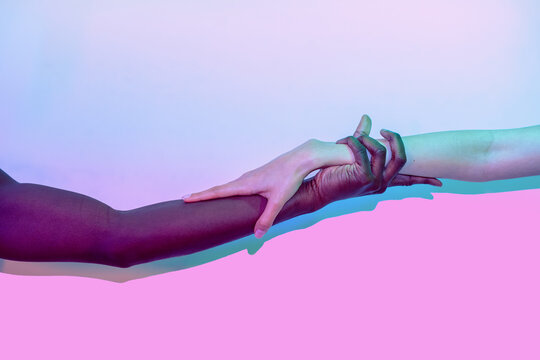 Multiethnic hands in artistic embrace