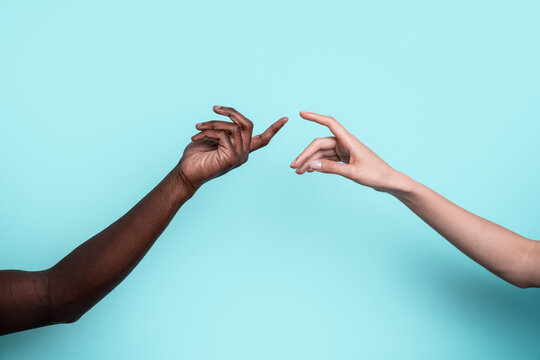 Connection between diverse hands on blue background