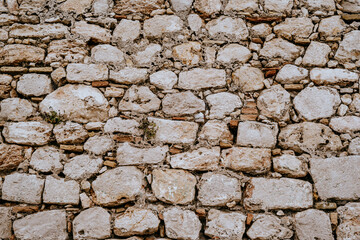 Old stone wall texture near the sea