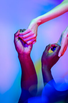 Multiethnic hands in vibrant colors showcasing unity