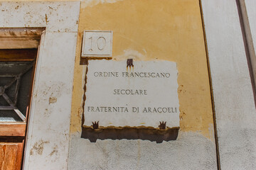 Classical Roman Street Sign Indicating an Iconic Alleyway in the Eternal City