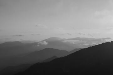 Obraz premium Landscape of the mountains with fog. Monochrome landscape