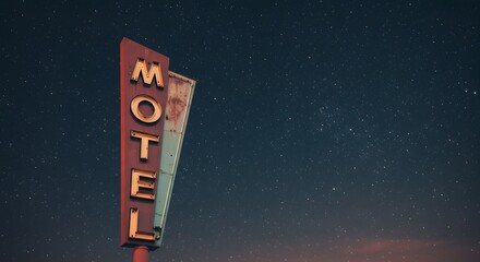An illuminated motel sign stands against a starspeckled night sky
